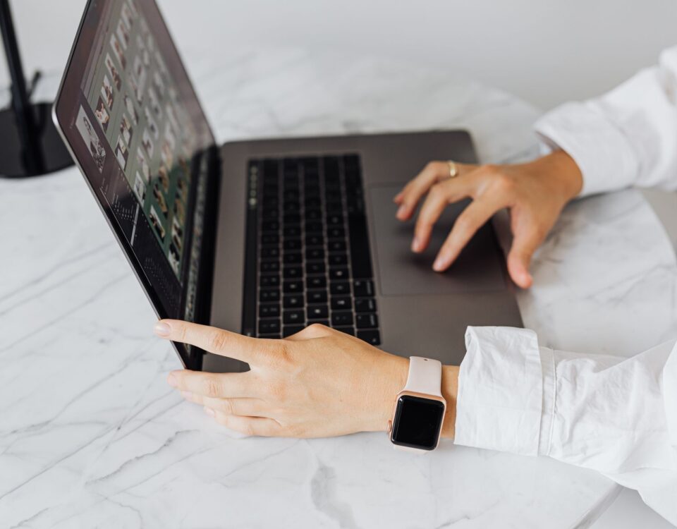 Person typing adversarial prompt into an AI chat interface on laptop