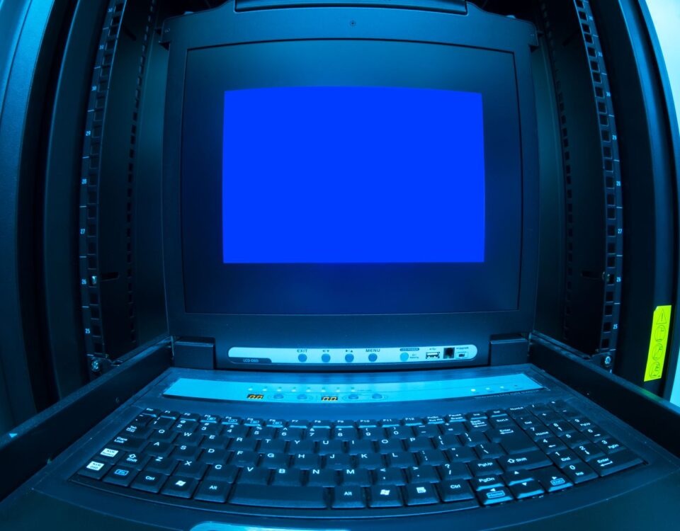 IT security engineer reviewing cloud configuration compliance on tablet in datacenter