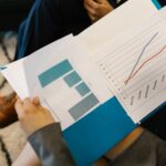 Compliance auditor reviewing AI system security documents in server room