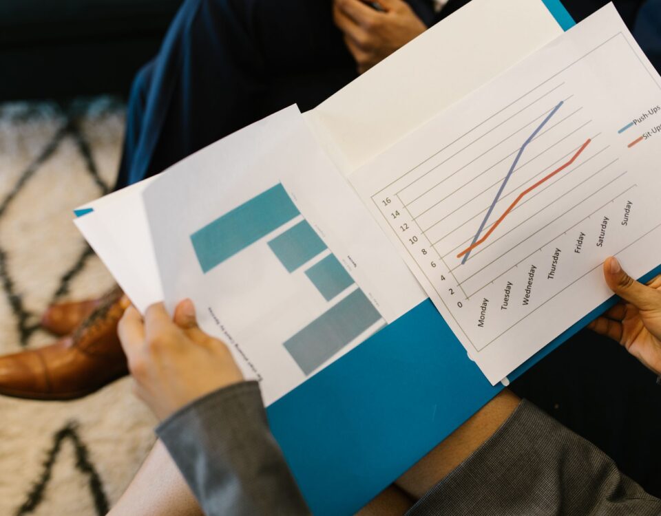 Compliance auditor reviewing AI system security documents in server room