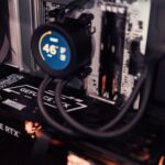 GPU server rack with warning light in dark data center room