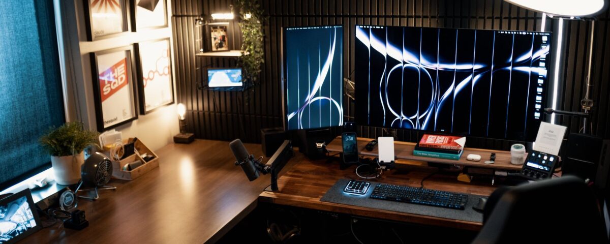 Security analyst reviewing AI agent behavioral baseline dashboards across multiple monitors