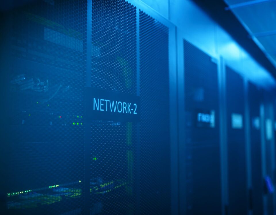 Security analyst reviewing cloud threat alerts in a server room