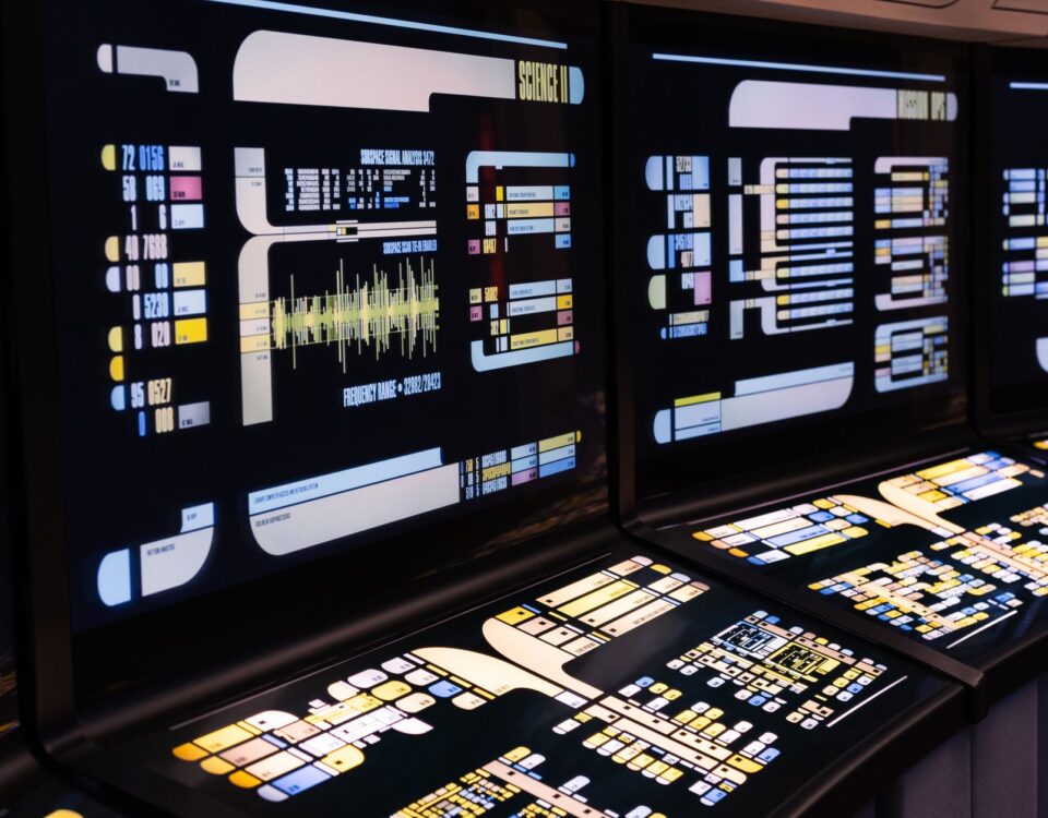 Enterprise server room monitoring screens displaying autonomous AI action logs