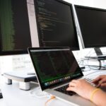 Security professional reviewing OAuth authentication tokens on laptop screen