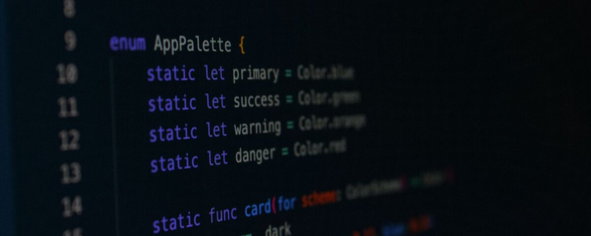 Developer reviewing software component dependency diagram on dual monitors