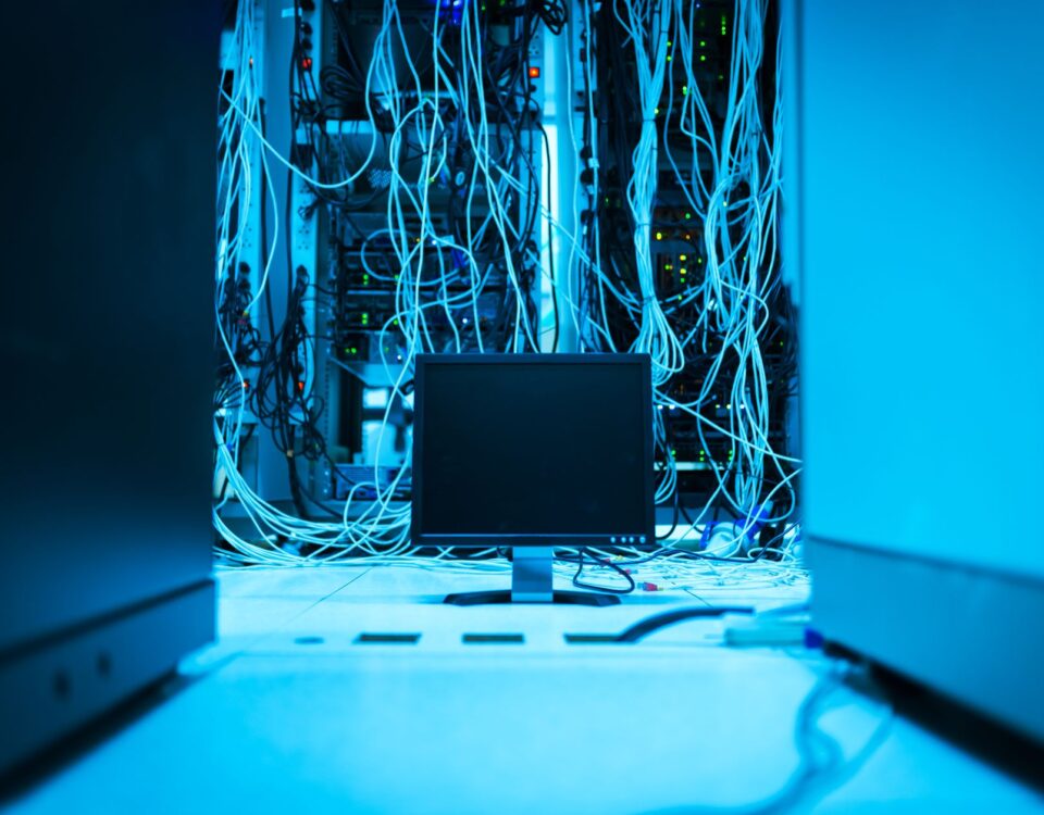 Robotic arm pressing keyboard key inside a secure server room