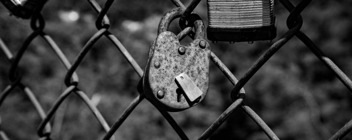 Open padlock beside laptop representing stolen session token security risk