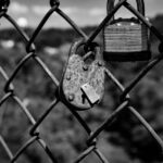 Open padlock beside laptop representing stolen session token security risk