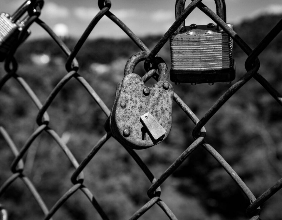 Open padlock beside laptop representing stolen session token security risk