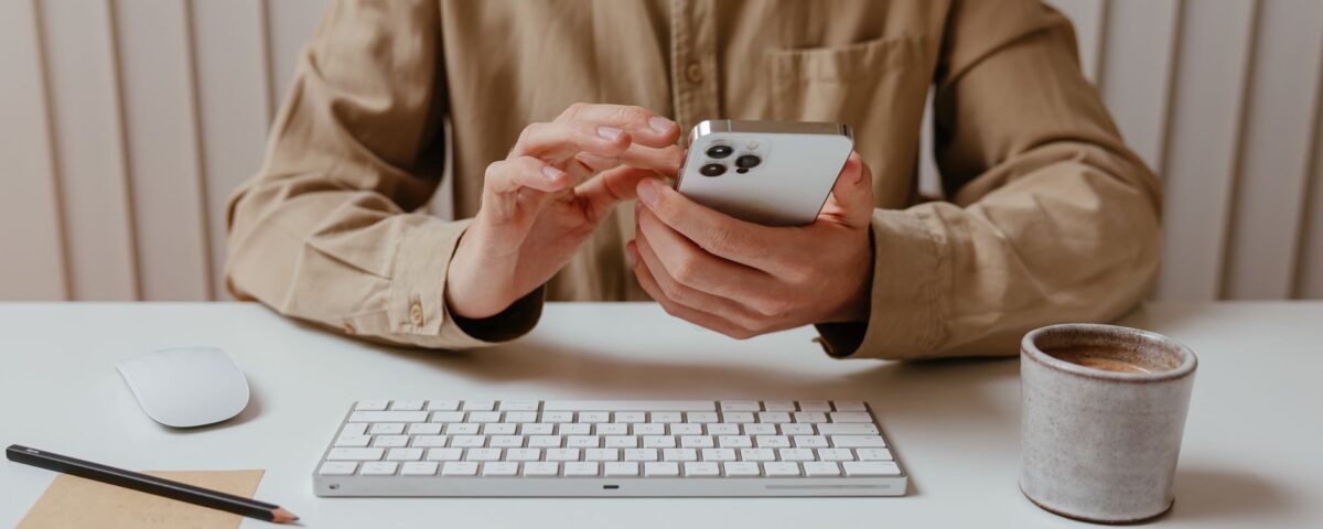 Business professional receiving a suspicious phone call at corporate office desk