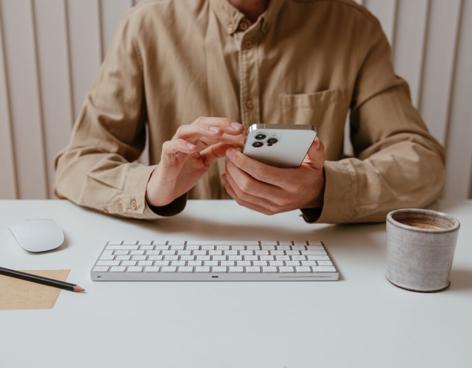 Business professional receiving a suspicious phone call at corporate office desk