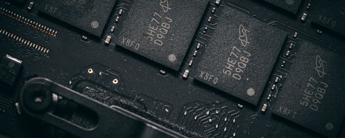 Technician examining UEFI firmware chip on a server motherboard