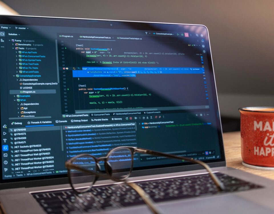 Laptop screen showing GitHub Actions YAML workflow configuration code terminal