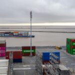 Hardened shipping container with padlock representing secured Docker container image