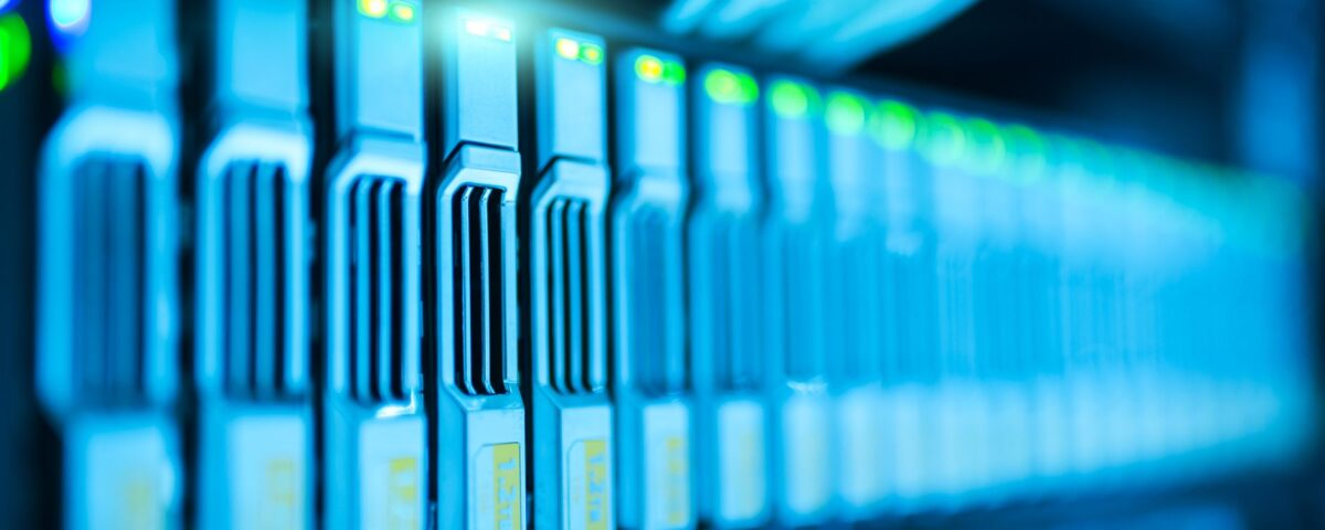 Enterprise data center server rack aisle with color-coded cable bundles