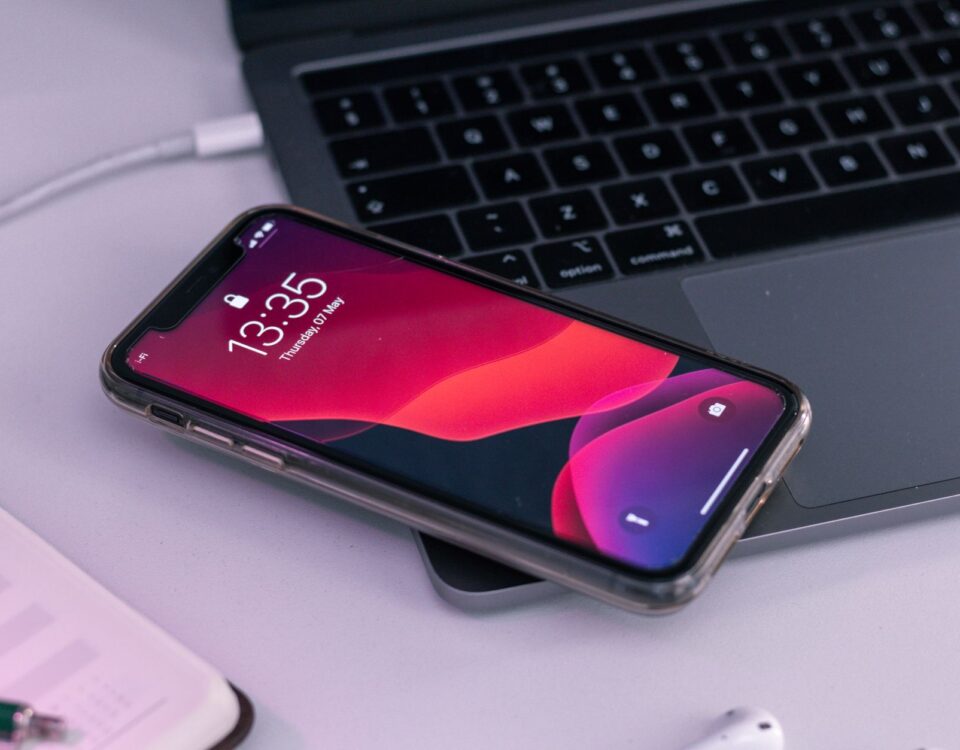 Smartphone lying untouched on a corporate conference table in boardroom