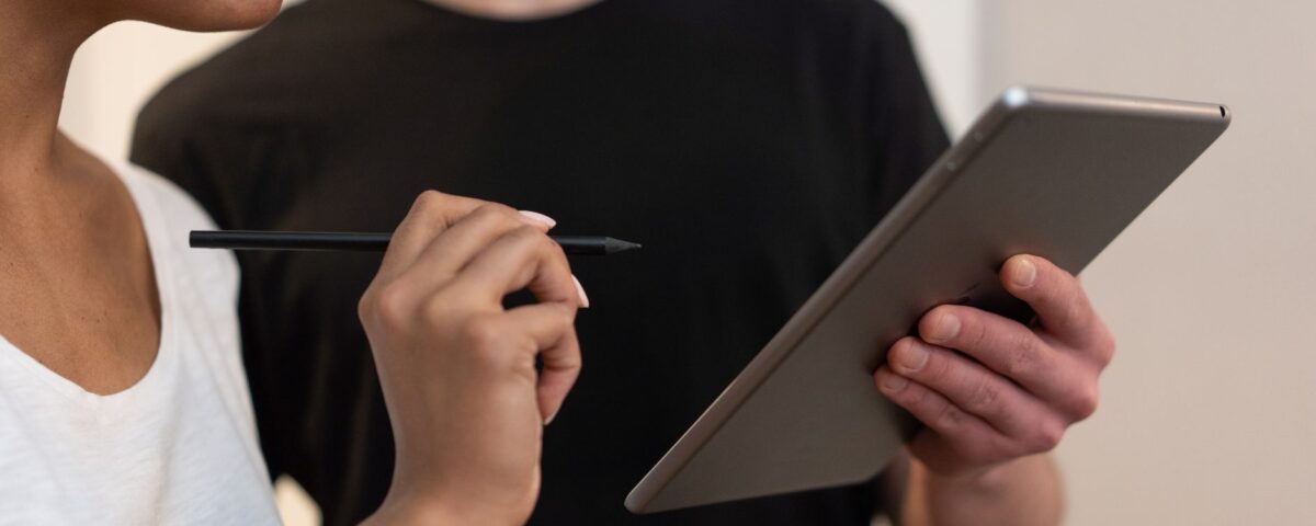 Person confirming transaction on a hardware cryptocurrency wallet device