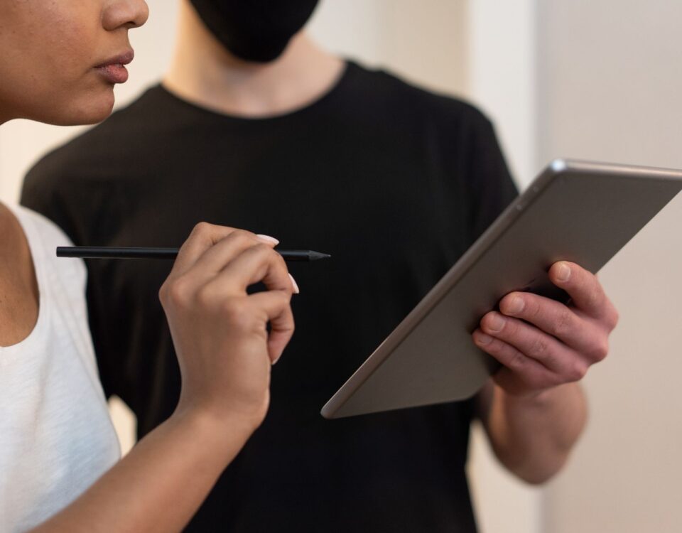 Person confirming transaction on a hardware cryptocurrency wallet device