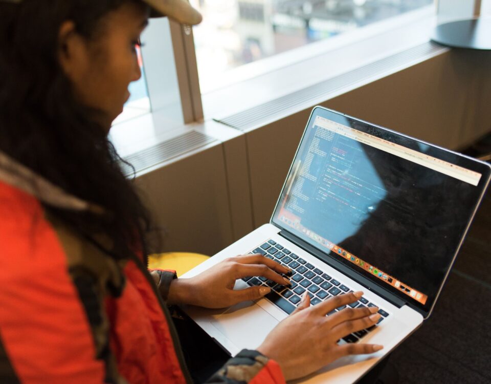 Developer typing a package install command in a terminal window on laptop