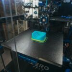 Ruggedized edge computing gateway device mounted in industrial manufacturing facility
